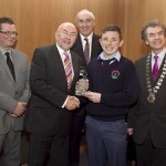 Cathal Dervan, member of the judging committee; Minister for Education, Ruairi Quinn, TD; Matt Dempsey, Chairman NNI; Aaron Amond, Presentation College, Carlow, 1st place Sport category; Martin Sisk, President, Irish League of Credit Unions